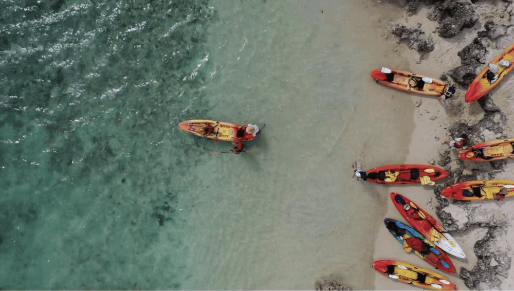 People begin paddling out to Popoia Island with their tandem kayak rental from Active Oahu